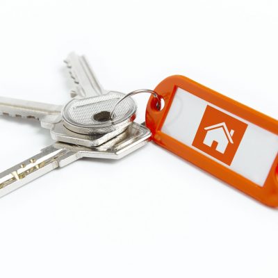 Key ring with keys over white background. Rent, buy